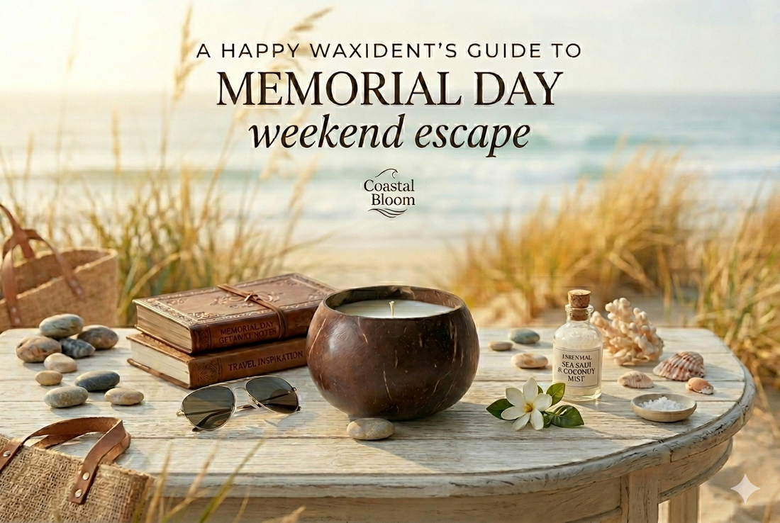 A Happy Waxident Coastal Bloom soy candle in a coconut shell on a beach table, themed for a Memorial Day weekend getaway.