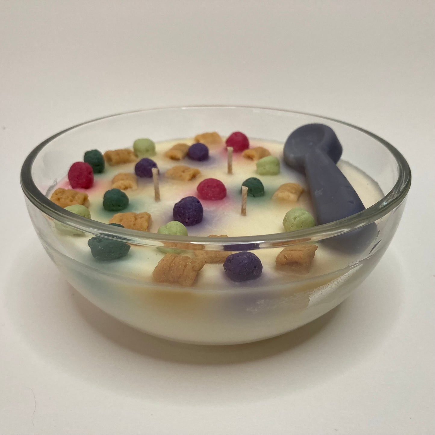Crunch Time Cap'n cereal scented soy candle with colorful soy cereal pieces.