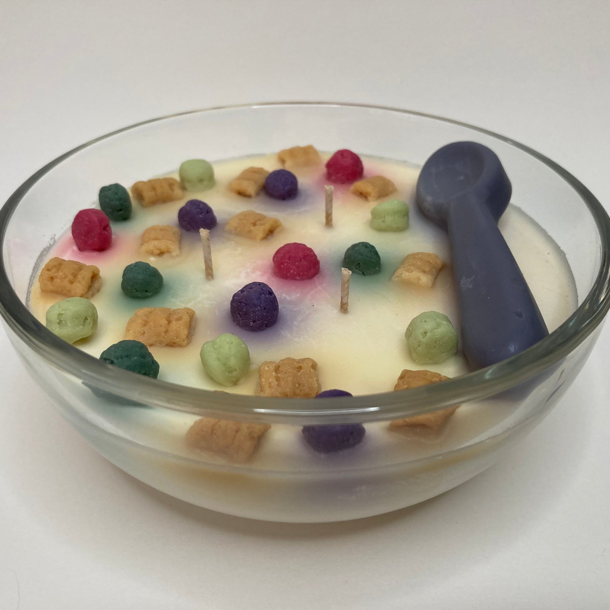 Crunch Time Cap'n cereal scented soy candle with colorful soy cereal pieces.