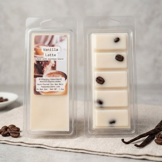 Vanilla Latte wax melts in packaging with vanilla beans and coffee beans on a neutral background