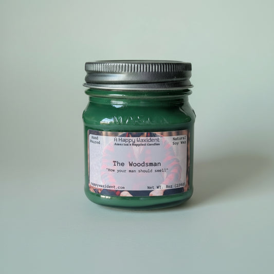 A Happy Waxident 'The Woodsman' 8oz Natural Soy Wax Candle in a Green Mason Jar with Metal Lid.